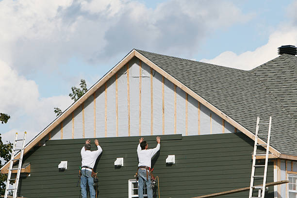 Professional Siding technician working in College Corner, OH